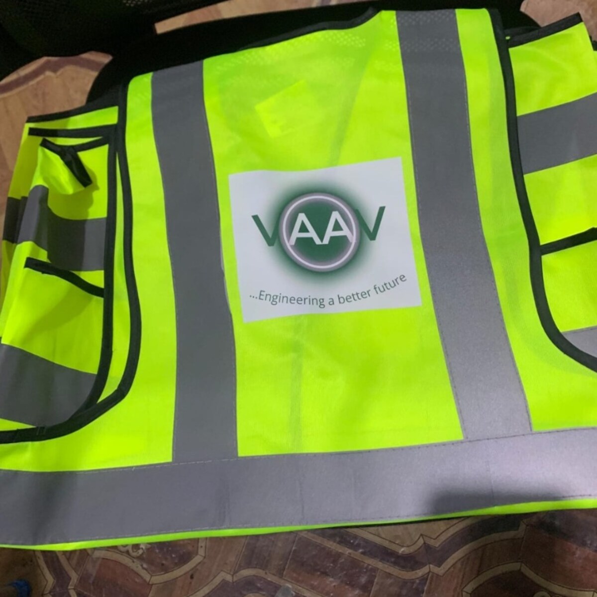 Branded reflective construction jacket print detail