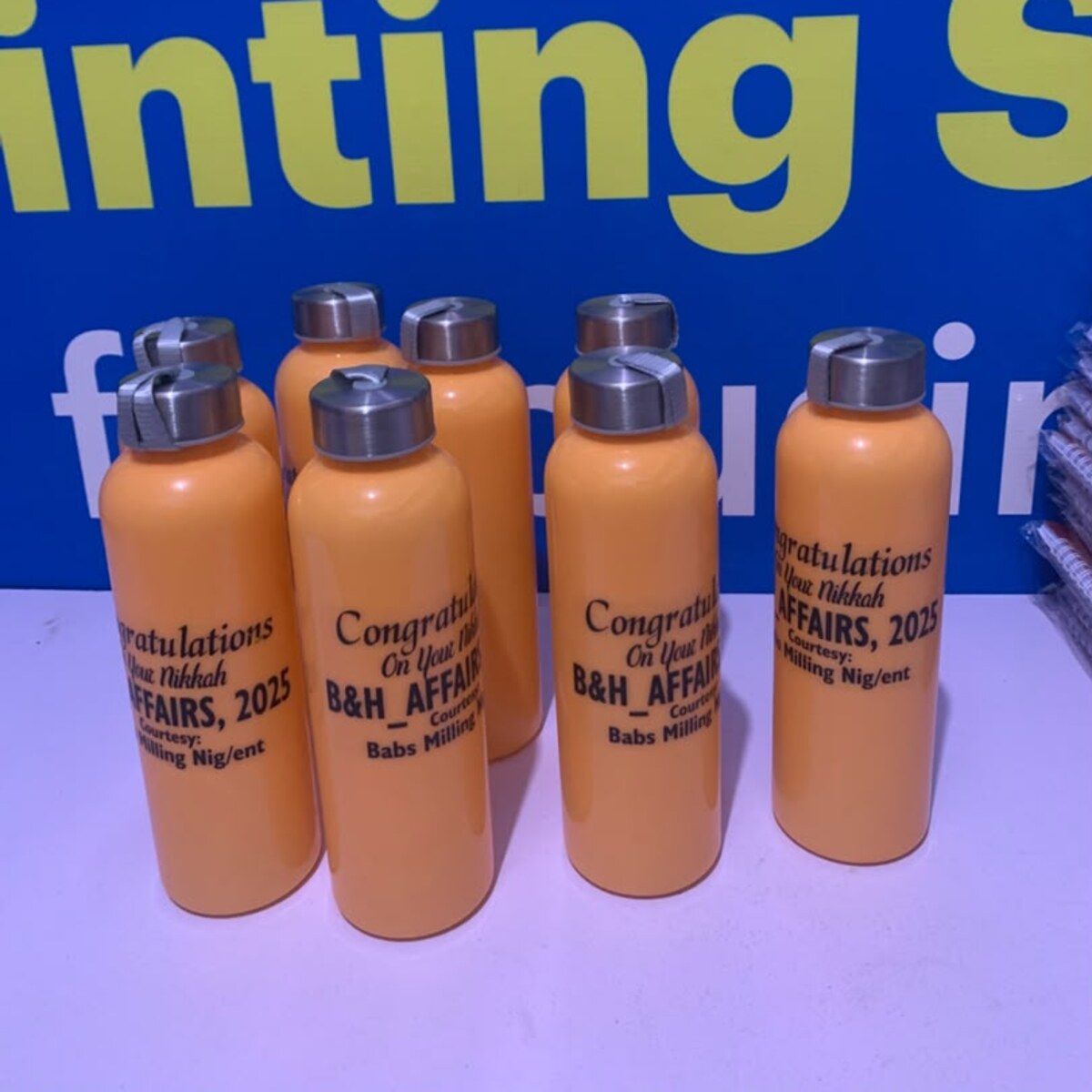 Custom branded orange metal water bottles by Waaprint